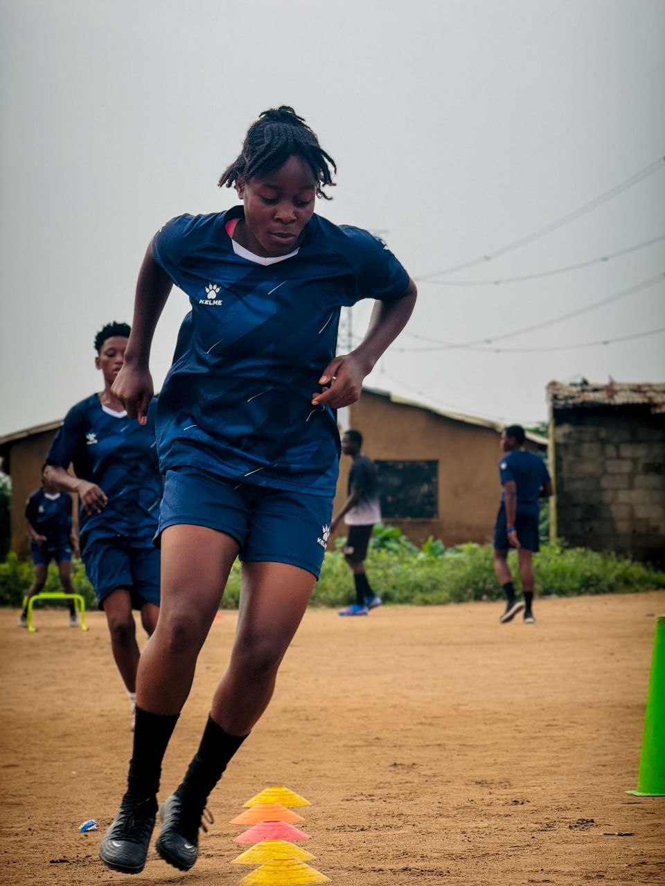 BlueWhale player training with teammates in the background